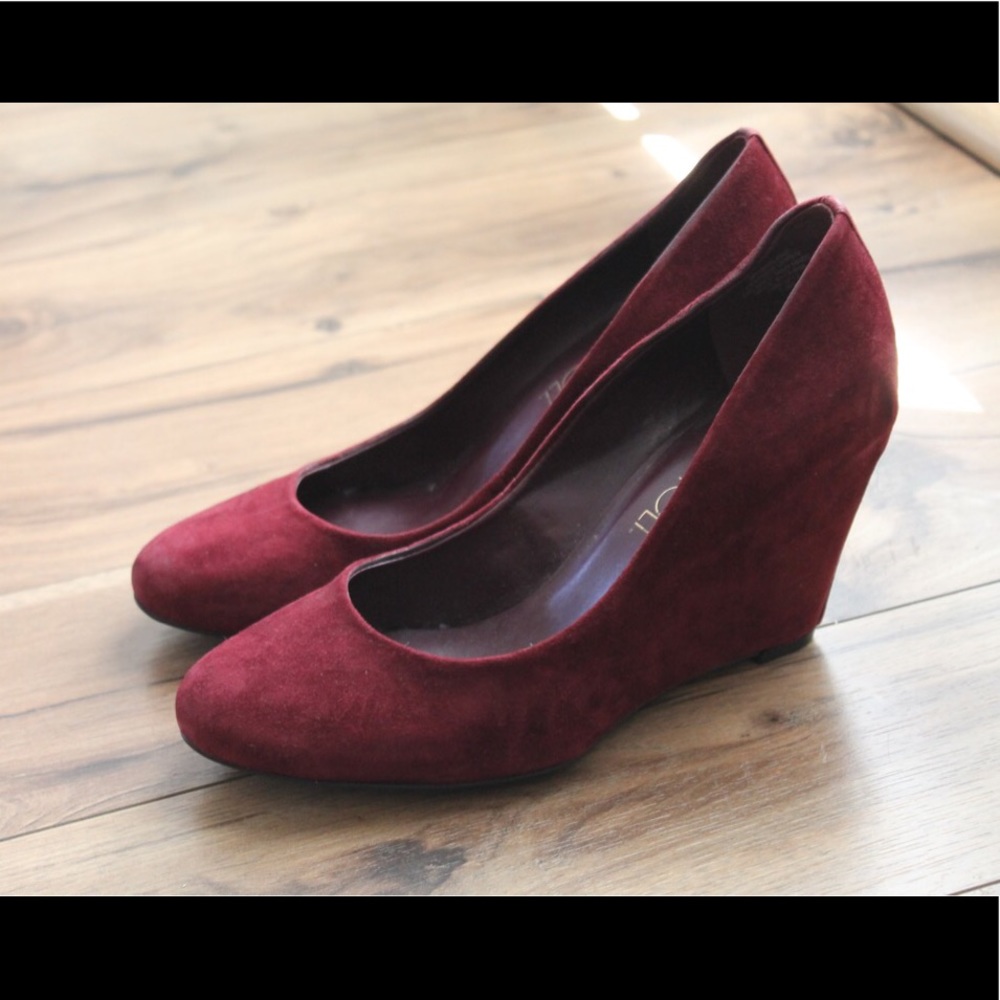 Burgundy suede wedge heels.
